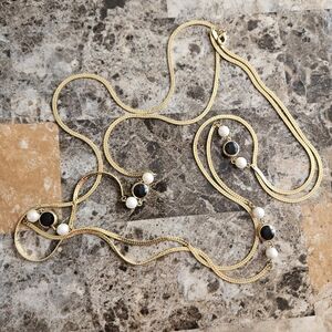 Elegant Gold Necklace with Black Onyx and White Pearl Accents